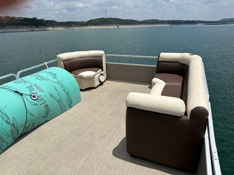 a boat that is sitting in front of a body of water