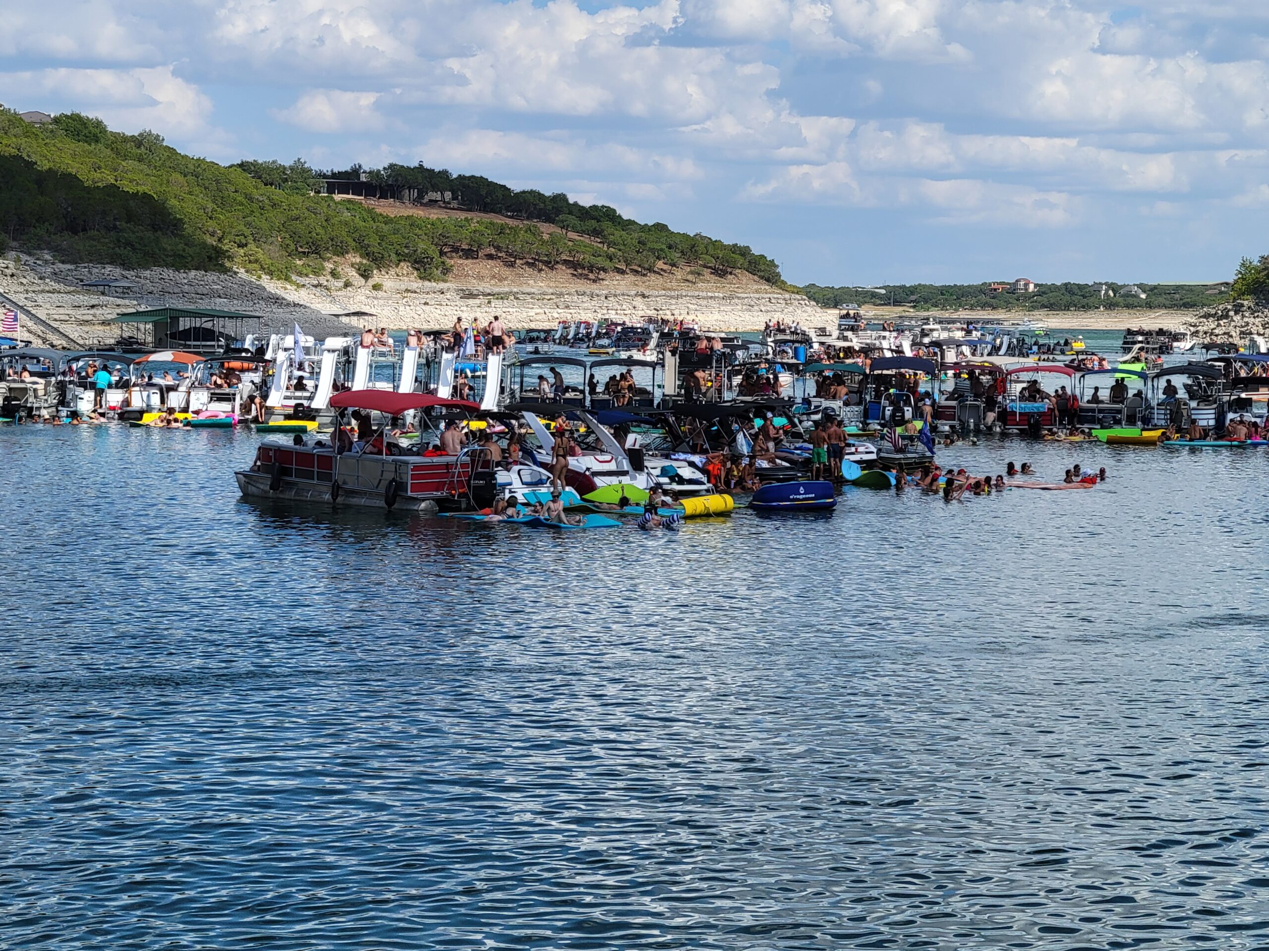 a group of people on a boat in a large body of water