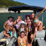 a group of people riding on the back of a boat