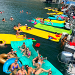 a group of people on a boat in the water
