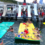 a group of people riding on the back of a boat
