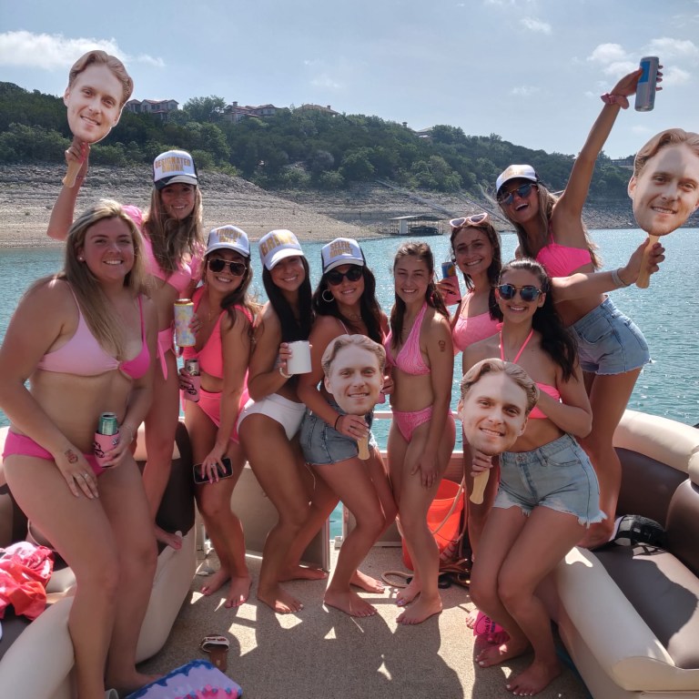 a group of people on Lake Travis posing for the camera