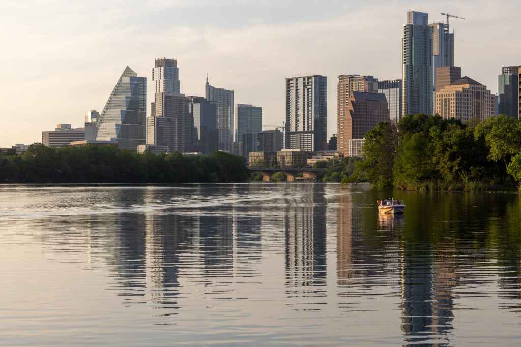 a large body of water with a city in the background