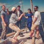 Colleagues talking on a boat